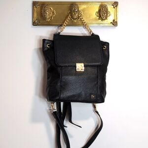 Packs Project Small Faux Black Pebbled Leather Backpack with Gold Accents.